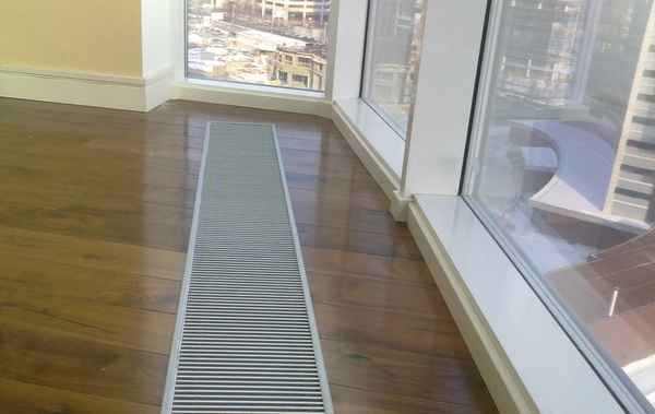 Встраиваемые в пол водяные конвекторы отопления: преимущества и недостатки